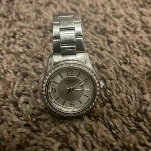 I am selling a citizen silver quartz watch for women